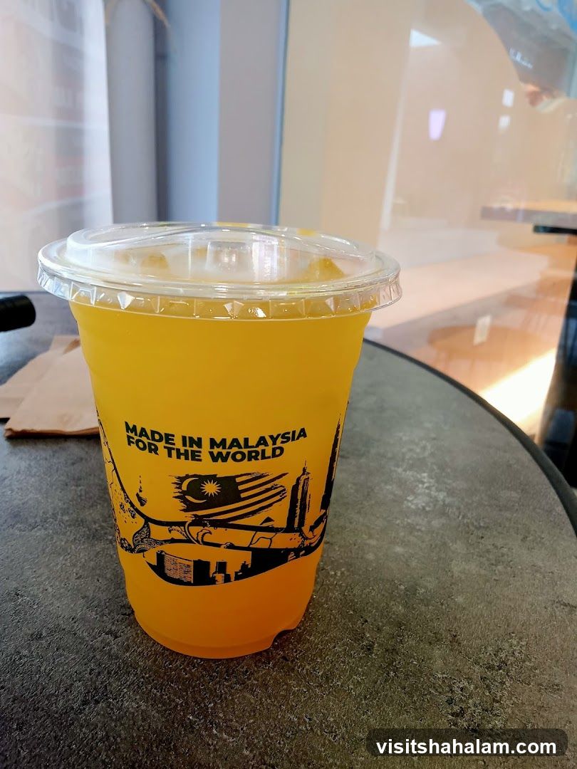 Orange Drink in a Branded Cup