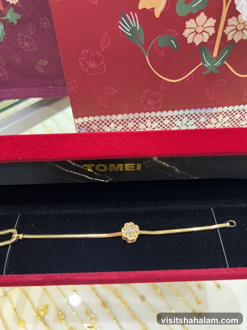 Gold Bracelet with Flower Charm