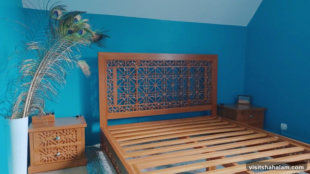 Bedroom with Peacock Feathers and Ornate Bed Frame