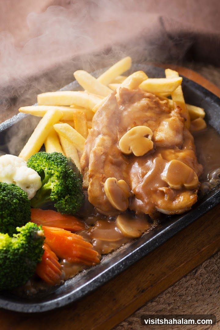 Sizzling Chicken with Fries and Vegetables