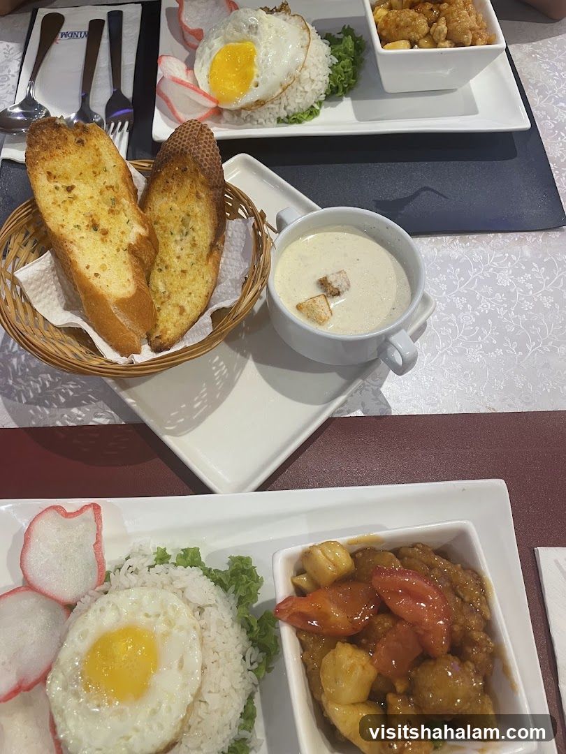 Food spread with rice, fried egg, and soup