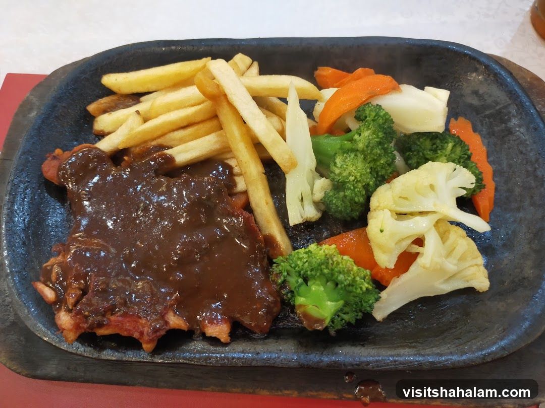 Sizzling Steak with Fries and Vegetables