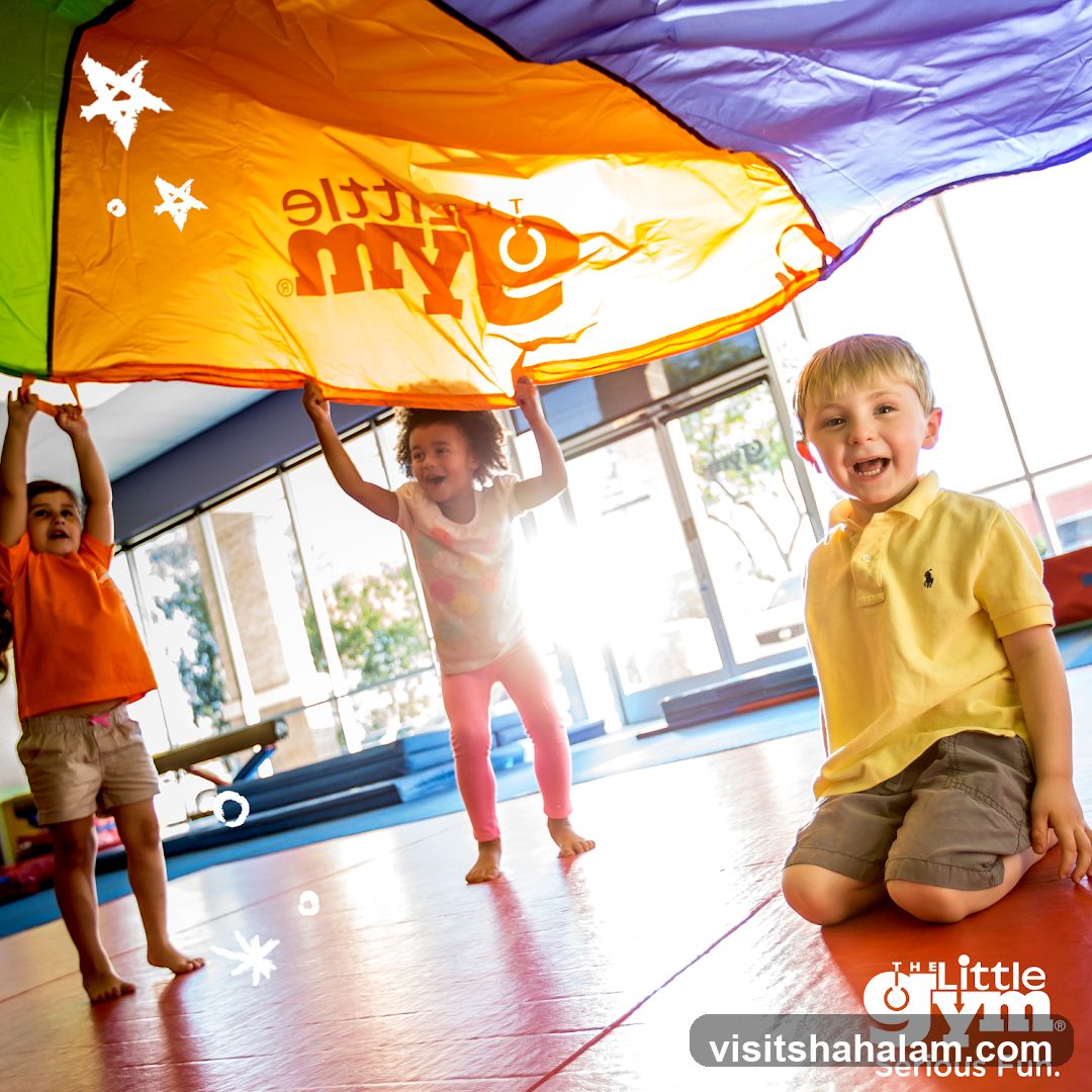 Children playing with a parachute