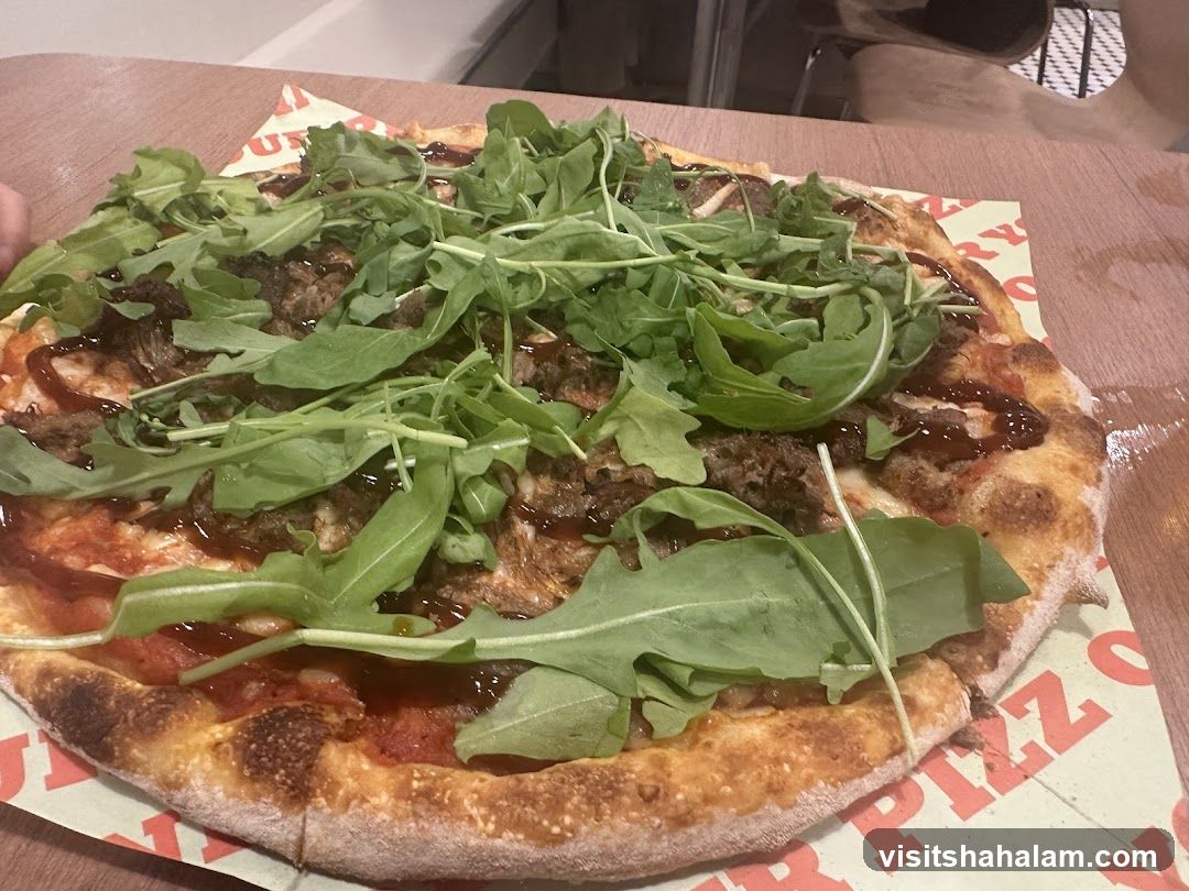 Pizza with Arugula and Meat