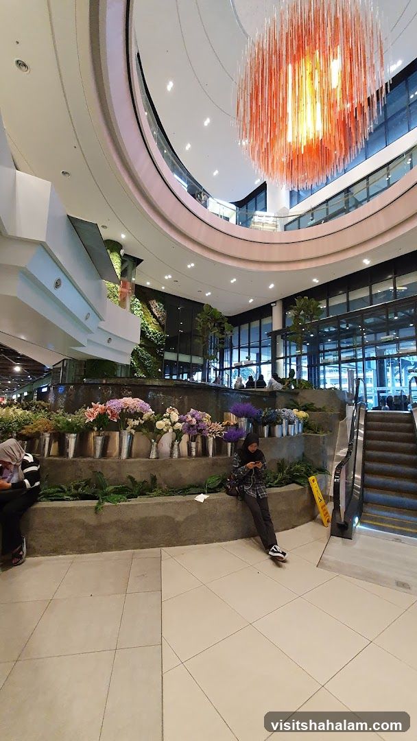 Indoor floral display with people