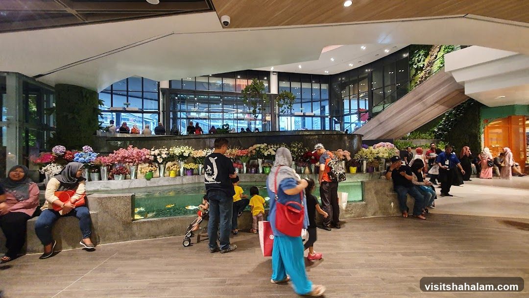 Indoor floral display with people