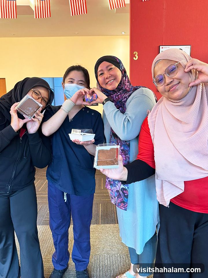 Four women holding brownies