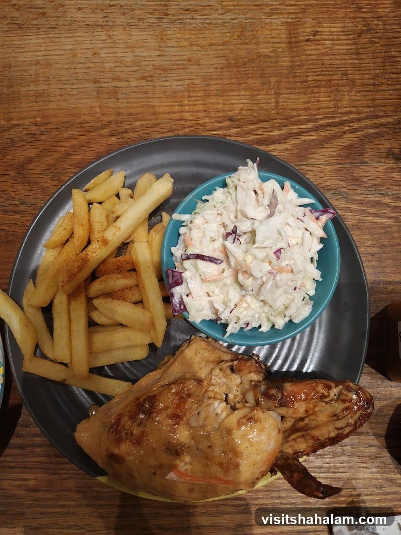Roasted chicken with fries and coleslaw