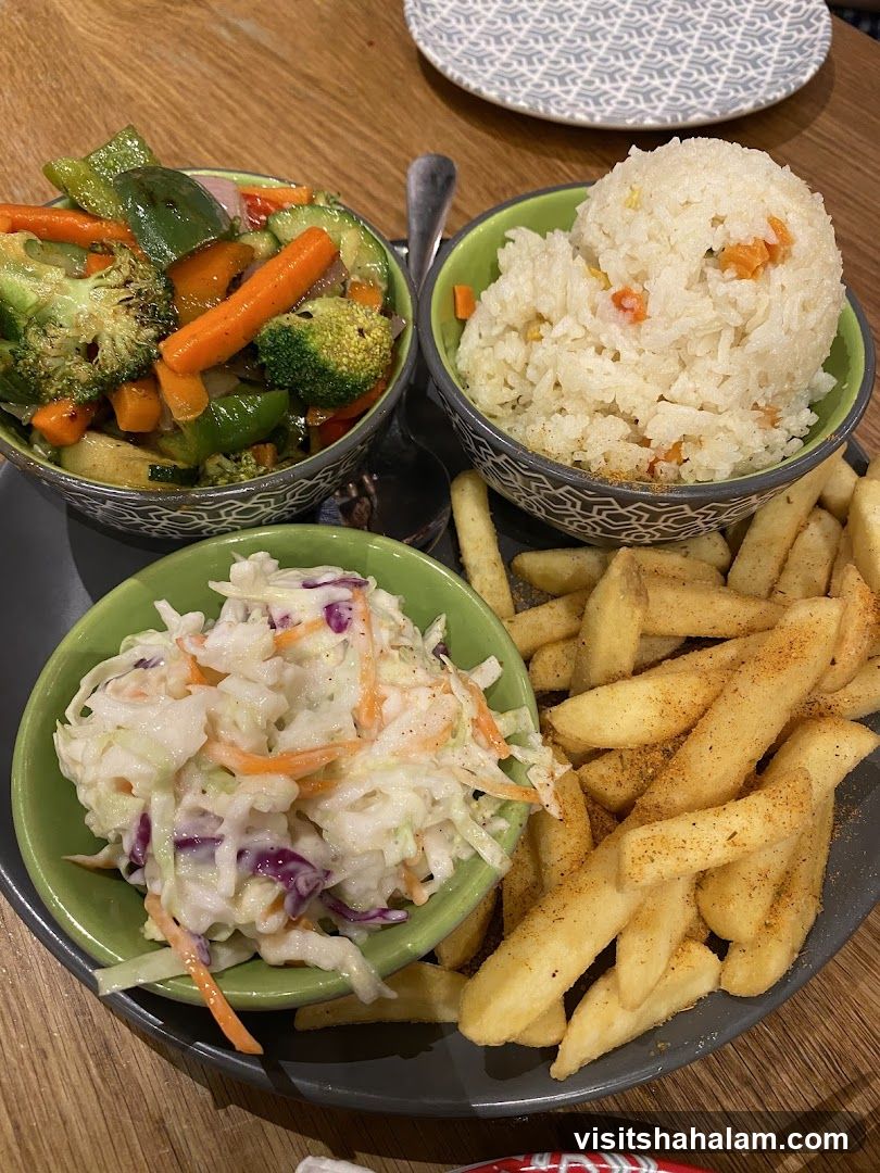 Meal with Fries, Rice, Coleslaw, and Vegetables
