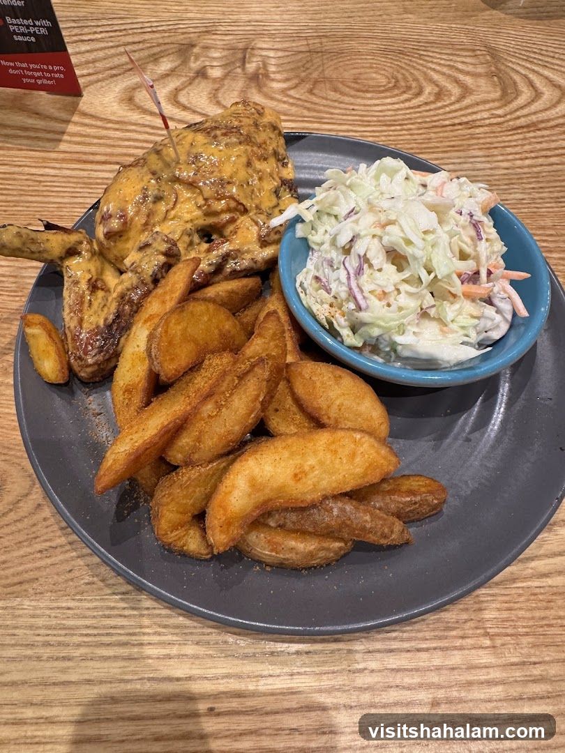 Chicken with wedges and coleslaw
