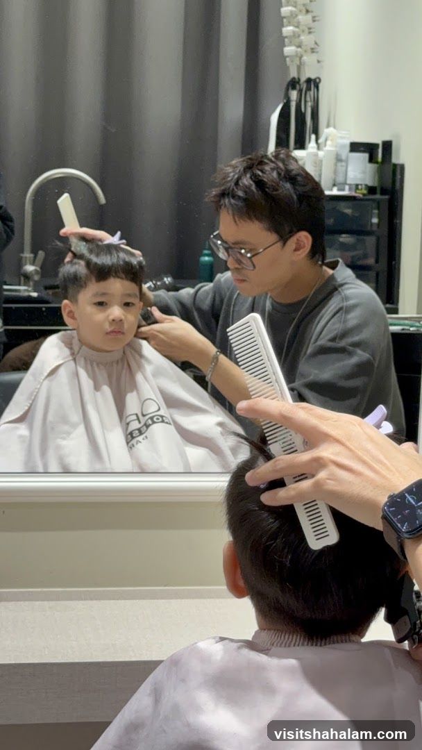 Barber cutting a child's hair