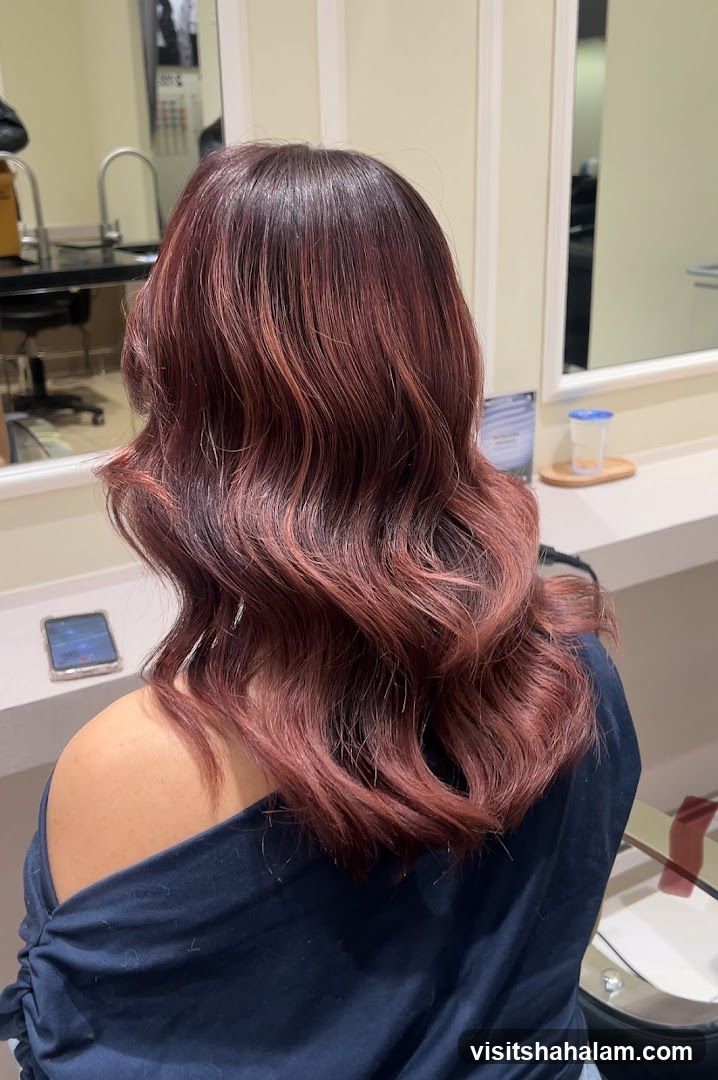 Woman with styled auburn hair