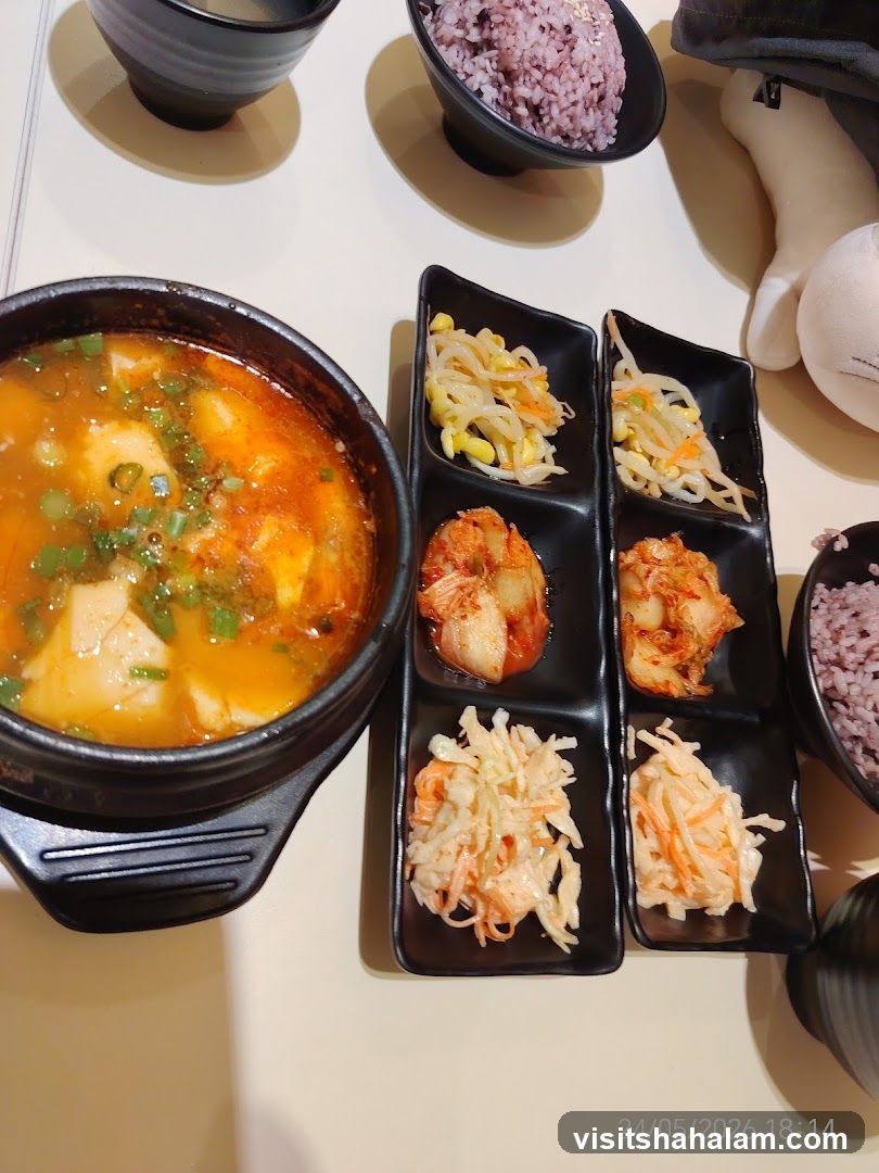 Korean Meal with Tofu Soup and Side Dishes
