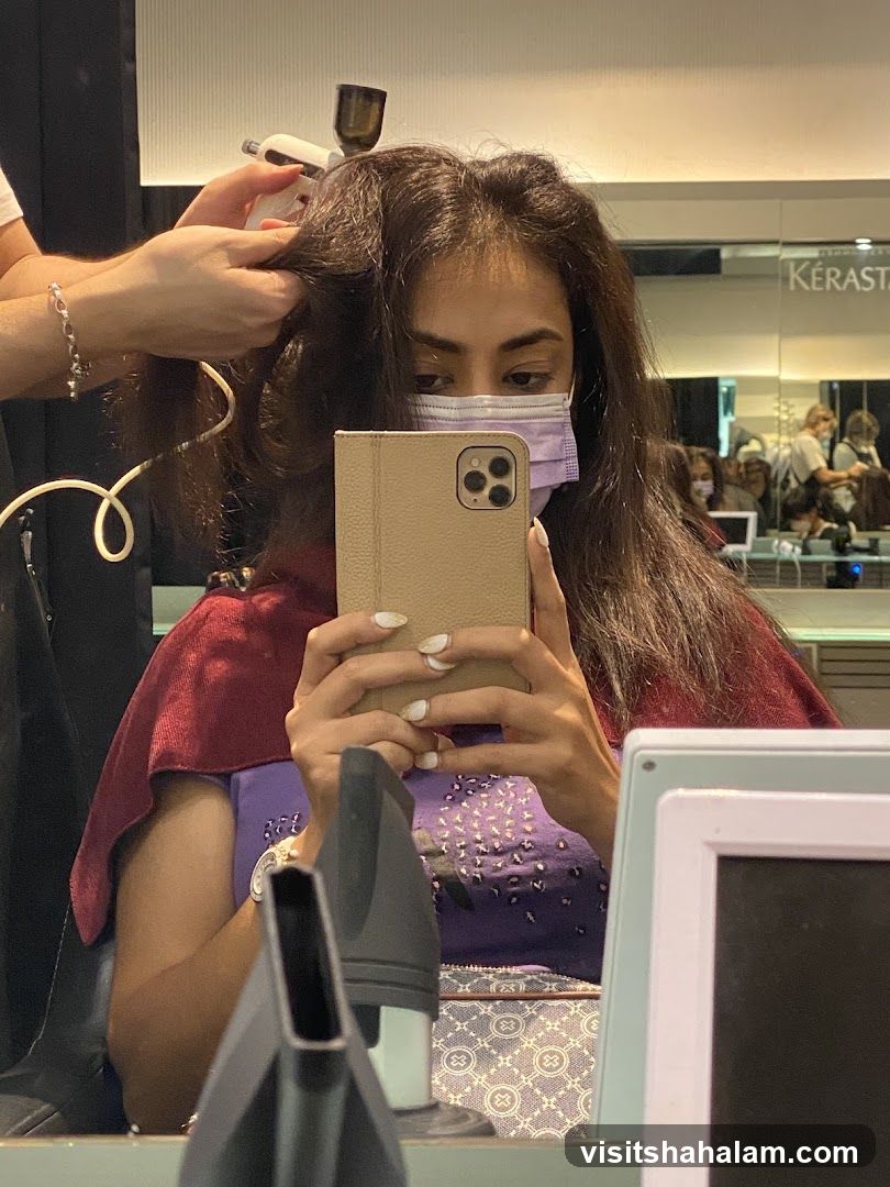 Woman getting hair styled