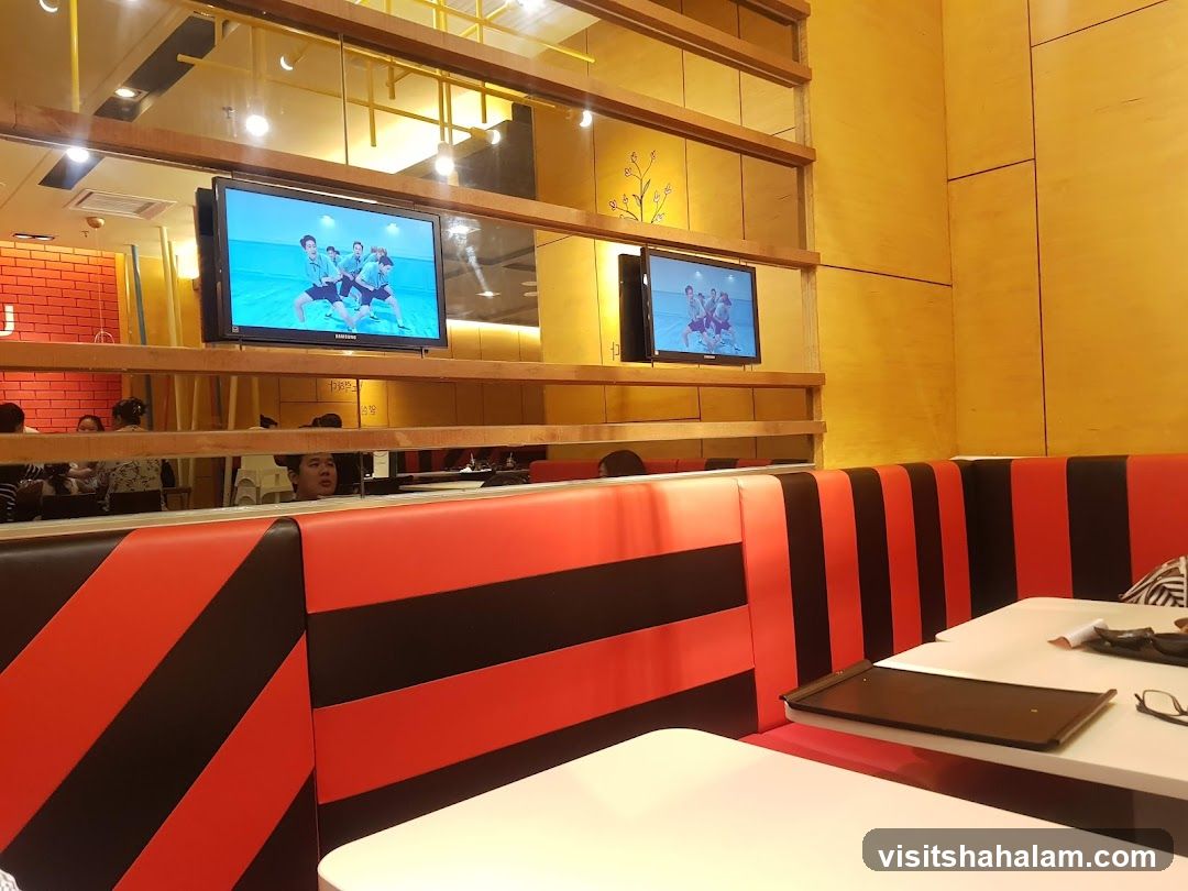Restaurant Interior with TVs and Booth Seating