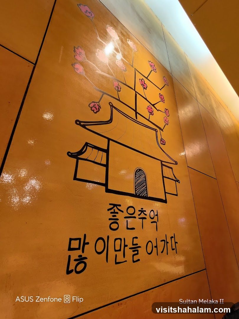 Korean text and illustration on wall